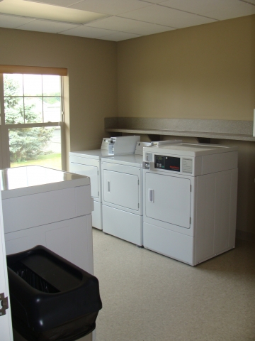 Monarch Manor Communal coin operated washer dryer