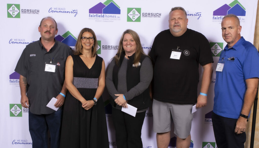 Fairfield Homes Employees near banner wall