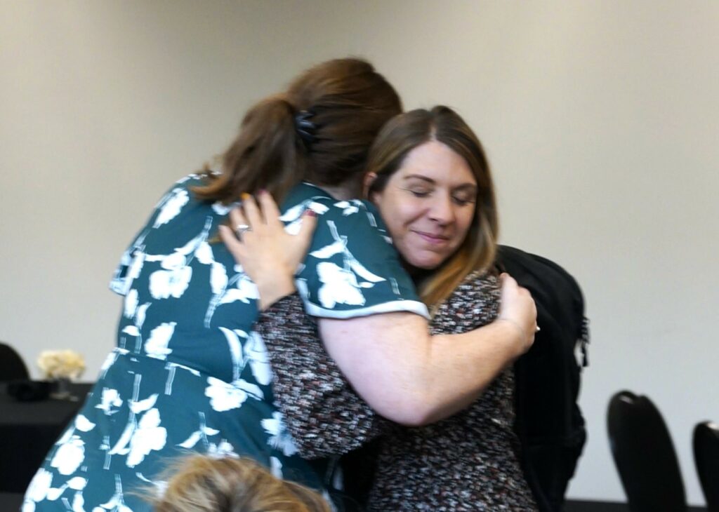 Team members hugging